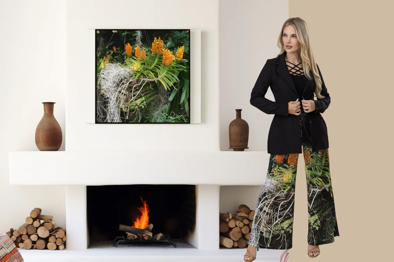 Modern room with "Luscious Tangerine" print on the wall behind a woman wearing the print on her pants