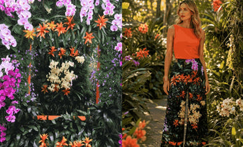 Modern room with "Flowers Galore" art print on the wall behind a woman wearing the print on her dress